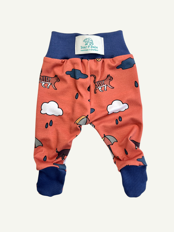 Orange Raining Cats & Dogs Baby and Children's Footed Leggings